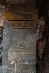 Ancient Temple Pillar with Faded Paintings