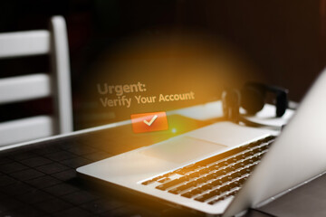 Cybersecurity threat: A laptop displays urgent notifications for account verification, a clear sign of a phishing scam and fake messages in the inbox