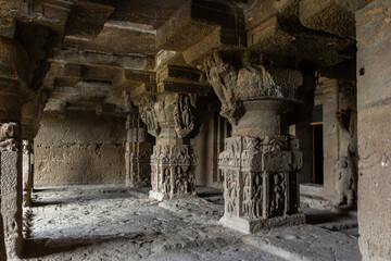 Ancient Cave Temple with Ornate Pillars