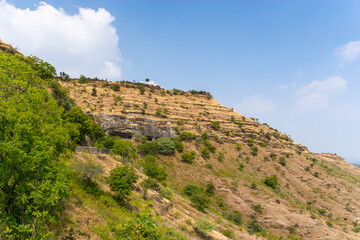 Fototapeta premium Ancient Caves on a Terraced Hillside, Maharashtra