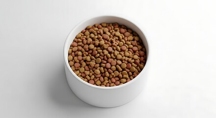 A bowl full of nutritious kibble food on a clean, white surface background