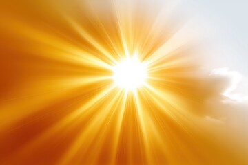 Fototapeta premium Radiant golden sunburst with bright rays and light flare in clear sky