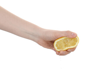 Woman squeezing lemon on white background, closeup