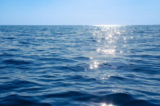 Sunlight dancing on serene ocean waves