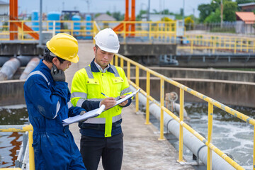 Environmental engineers work at wastewater treatment plants,Water supply engineering working at Water recycling plant for reuse,Technicians and engineers discuss work together.