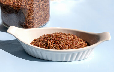 Healthy uncooked raw red or brown rice. High quality photo