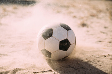 soccer ball on the sand