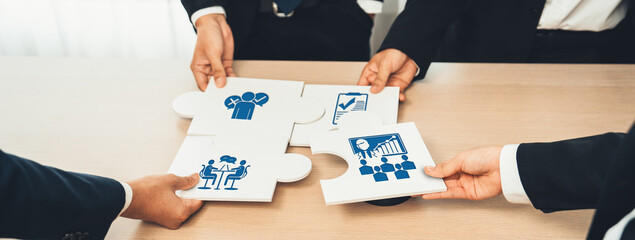 Engaging visual of diverse hands assembling puzzle pieces, highlighting critical themes in...