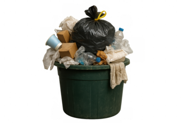Overflowing green garbage container stuffed with plastic bottles, cardboard, paper waste, standing against transparent backdrop