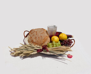 offerings of bread and wine to the saint