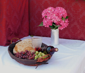 offerings of bread and wine to the saint