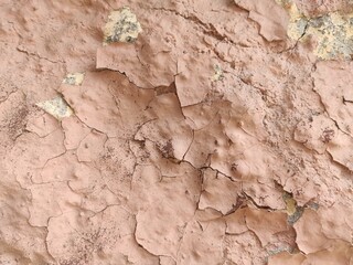 Old peeling plaster texture in soft beige tones for shabby chic design or retro graphic backdrops