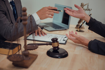 Businessmen consult with lawyers, submit additional documents, and pay for lawyers' services. After reaching an agreement and signing the contract, the two shake hands. Concept, Justice, and Lawyers