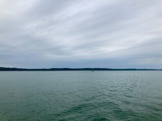 paddle boarder in distance on lake
