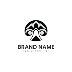A stylized mountain logo featuring abstract shapes resembling nature and adventure, combining black and white colors for a modern touch.