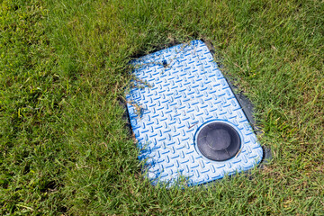 Close up of Water Utility Meter Box in Yard of Home