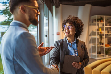 African american businesswoman handshake with caucasian man colleague
