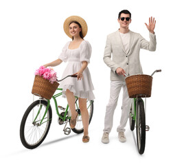 Handsome man and beautiful woman with bicycles on white background