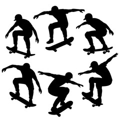 Silhouetted skateboarders in action poses