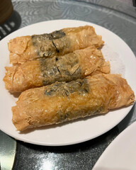Bean curd skin rolls tightly packed together.