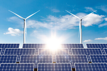 Clean energy concept, Solar power plant and wind turbines at beautiful sunset background.