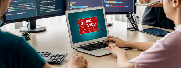 Virus warning alert on computer screen detected brisk cyber threat , hacker, computer virus and...