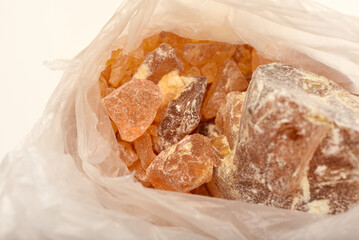 Pine rosin in a package. Solid pine resin flux for soldering.