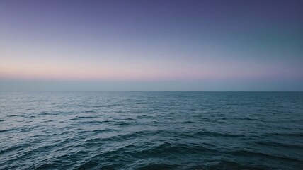 Obraz premium Calm ocean horizon under a soft gradient sky at dusk or dawn