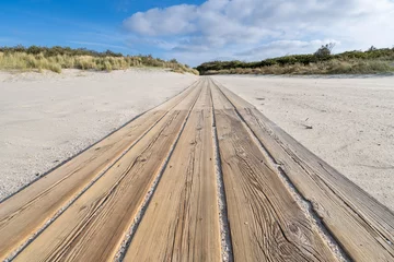 Tableaux sur Plexiglas wooden plank path through the dunes at the North Sea coast in Zeeland, Netherlands