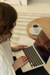 Laptop user working in bright natural light