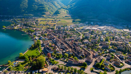 A panoramic aerial view around the old town of the city Villeneuve in Switzerland on a sunny spring noon