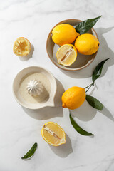 fresh lemons with juicer