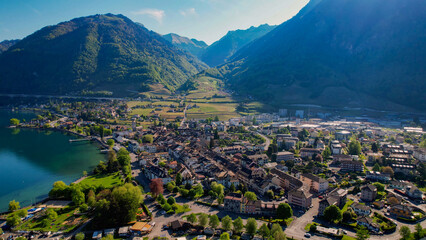 A panoramic aerial view around the old town of the city Villeneuve in Switzerland on a sunny spring noon