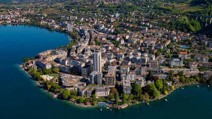 A panoramic aerial view around the old town of the city Montreux in Switzerland on a sunny spring noon