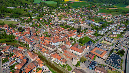 Panoramic aerial of the old town of the city Moudon in Switzerland on a sunny noon in summer