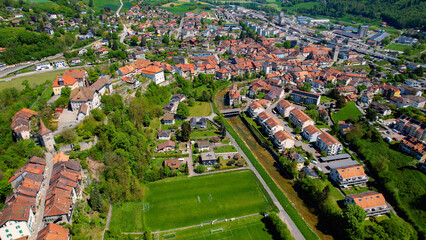 Panoramic aerial of the old town of the city Moudon in Switzerland on a sunny noon in summer