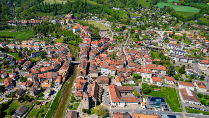 Panoramic aerial of the old town of the city Moudon in Switzerland on a sunny noon in summer