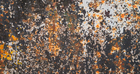 Wall with red brown black paint splashes as abstract texture background for banner template page. covered with various colors and textures rough worn look. Chaos and disorder scene