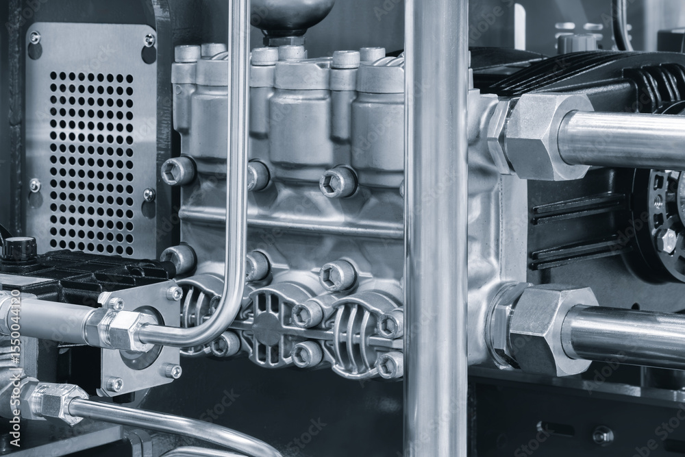 Aufkleber machine with a silver pipe and a black part. the machine is made of metal