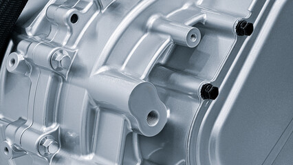 An intricate engine component is positioned prominently, highlighting its polished surface and...