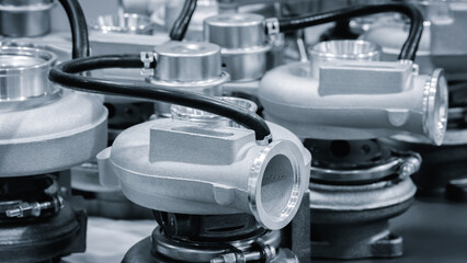 Several turbochargers arranged neatly in a workshop highlight the complexity and precision of...