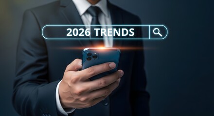Businessman researching future trends using a smartphone  for 2026 predictions and market analysis.