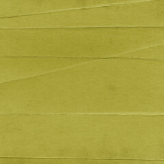 Fototapeta premium Olive green grunge paper texture with subtle creases, folded lines, and worn surface details, ideal for posters, scrapbooking, overlays, invitations, digital art, and creative design projects.