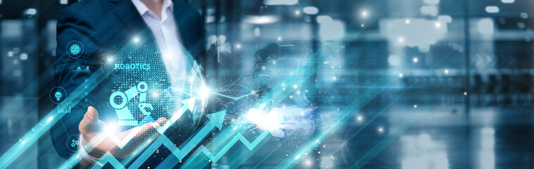 Businessman holding robotics innovation and intelligent automation global network, machine...