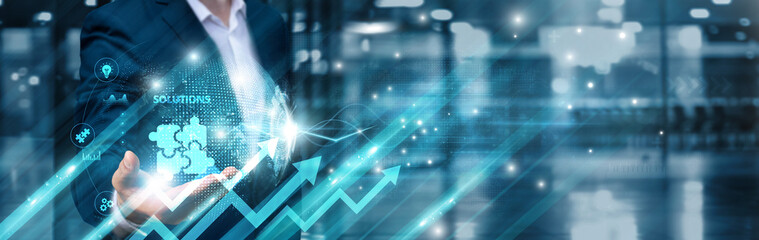 Businessman holding intelligent solutions icon and integrated infrastructure global network,...
