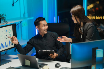 Business Professionals Analyzing Data in Office