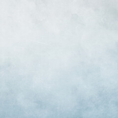 Fototapeta premium Soft pale blue watercolor background with gentle cloud-like blending, subtle gradients, and a calm dreamy atmosphere ideal for winter themes, invitations, posters, and digital design projects.
