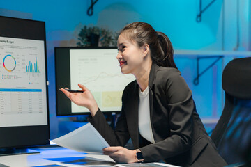 Smiling Asian Businesswoman Analyzing Data