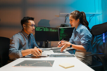 Software Developers Collaborating Late at Night