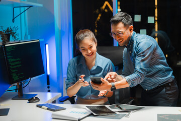 Collaborative Developers Working Late in Office